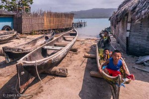 Kuna children in dugout canoe, Isla Tigre
